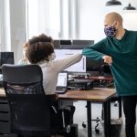 employees in office space social distancing