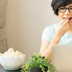 Employee having a popcorn breakroom snack while working