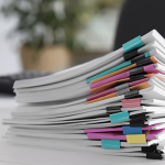 Stack of copy paper sitting on office desk